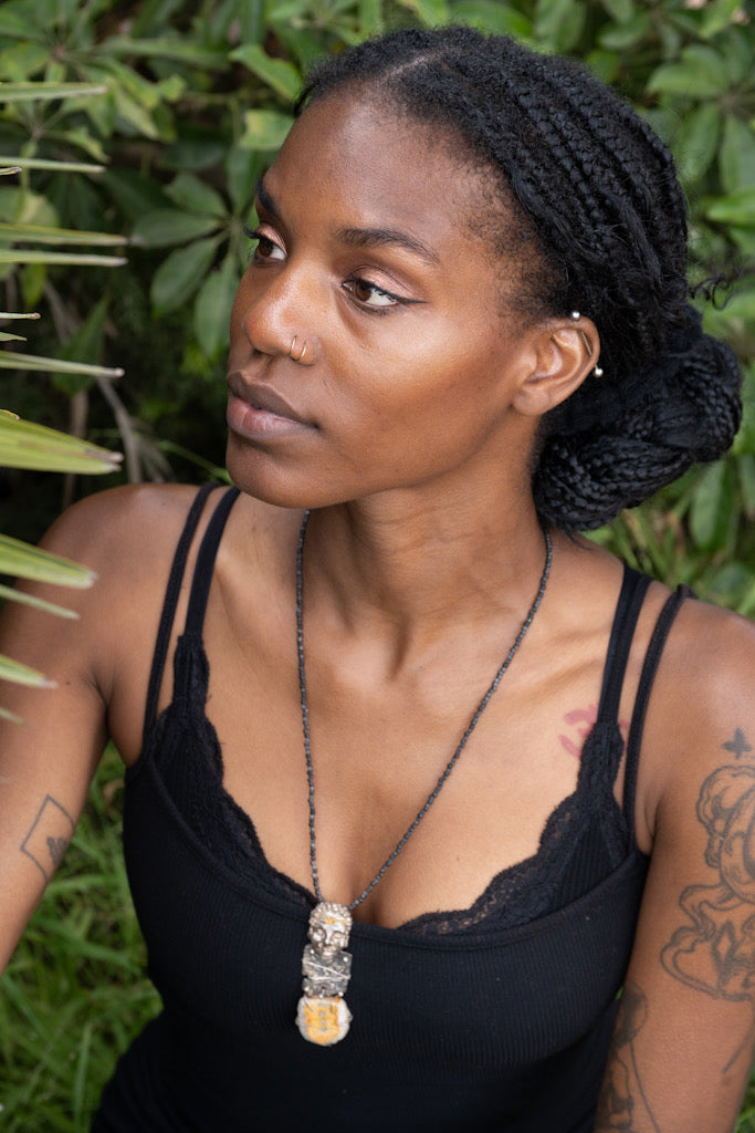 Woman wearing In Golden Solitude Necklace