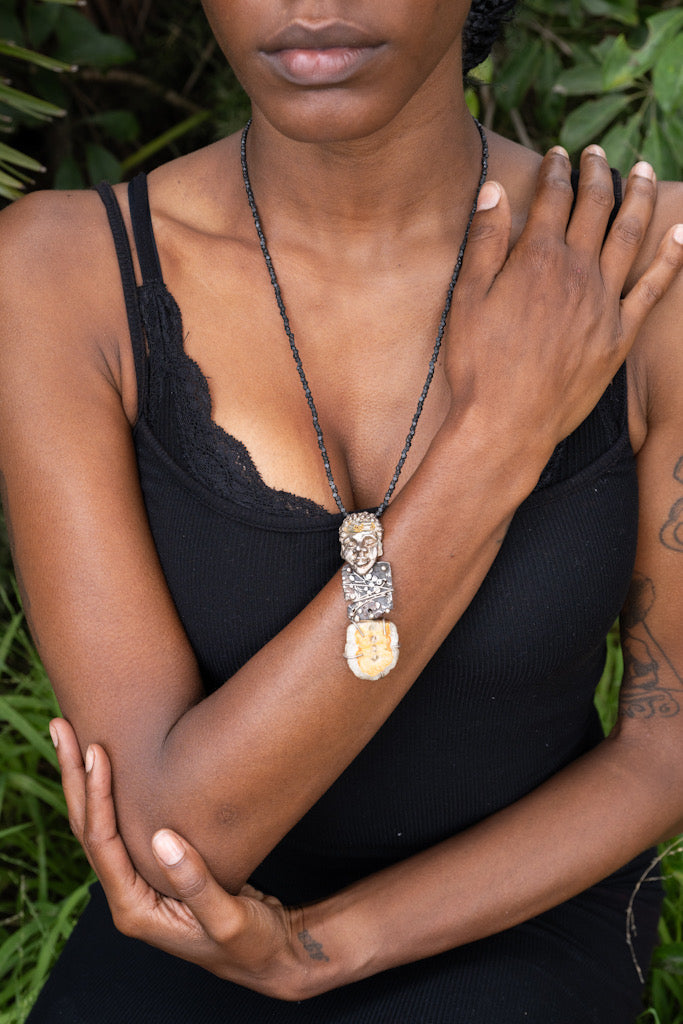 Woman wearing In Golden Solitude Necklace