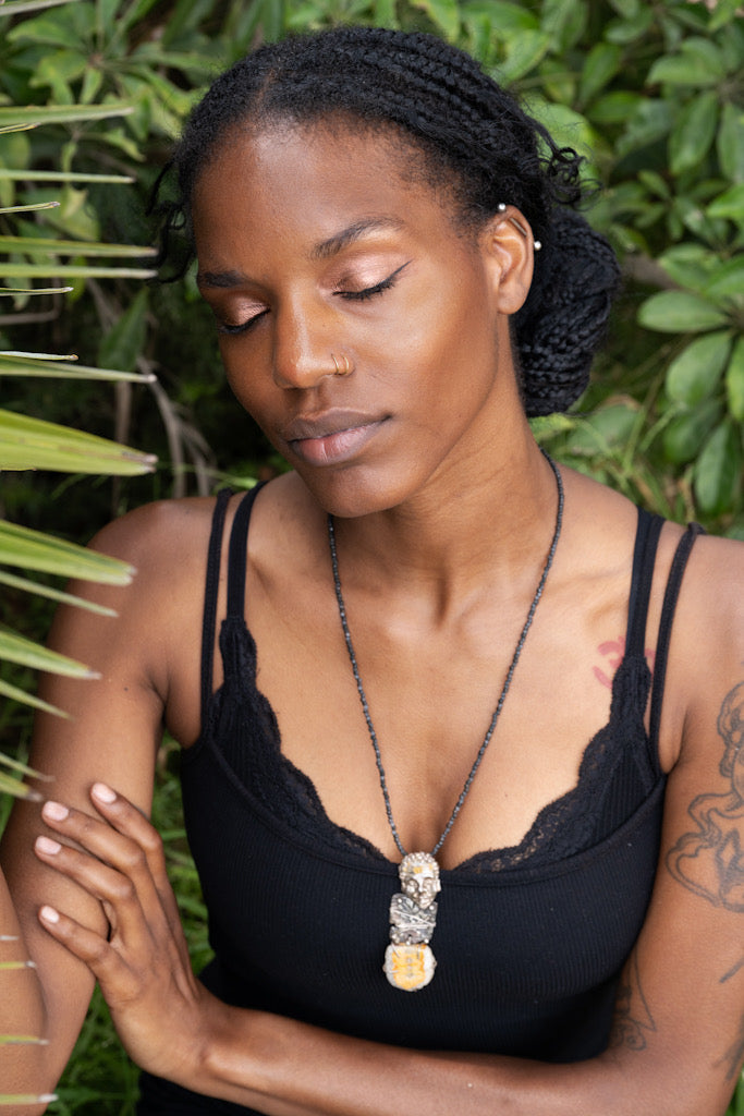 Woman wearing In Golden Solitude Necklace