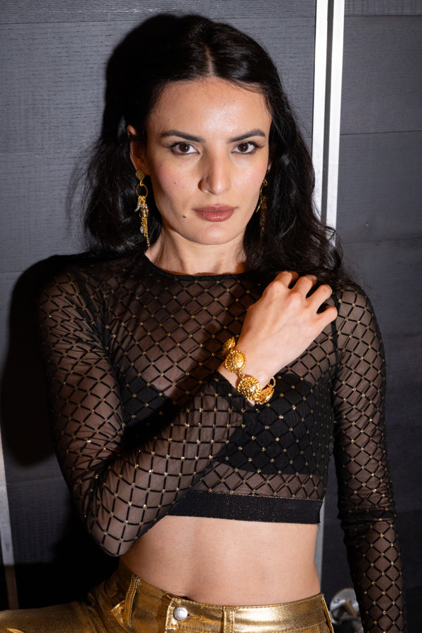 Woman wearing Soulection bracelet